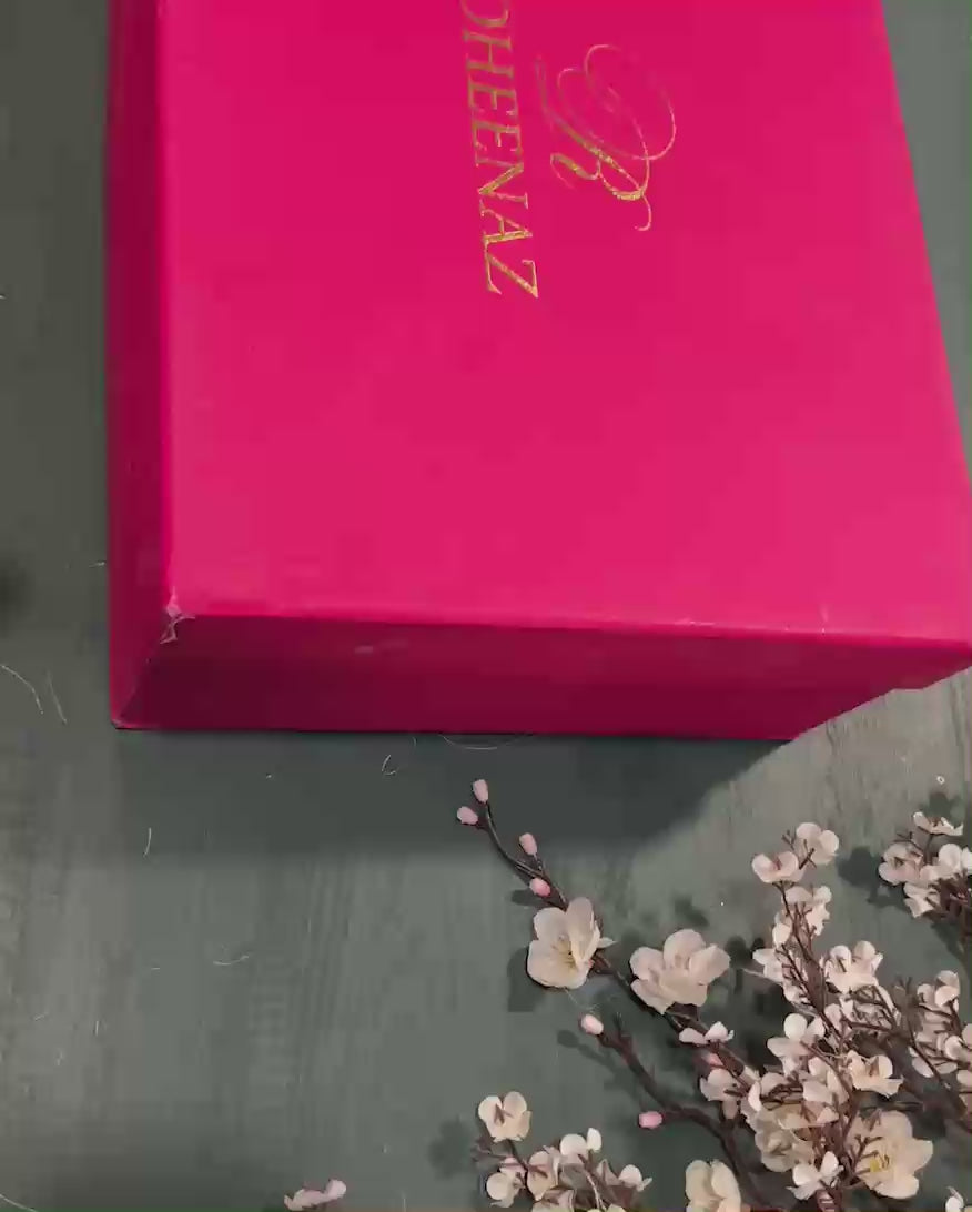 Unboxing the Blush Whisper suit from Roheenaz's signature pink gift box packaging