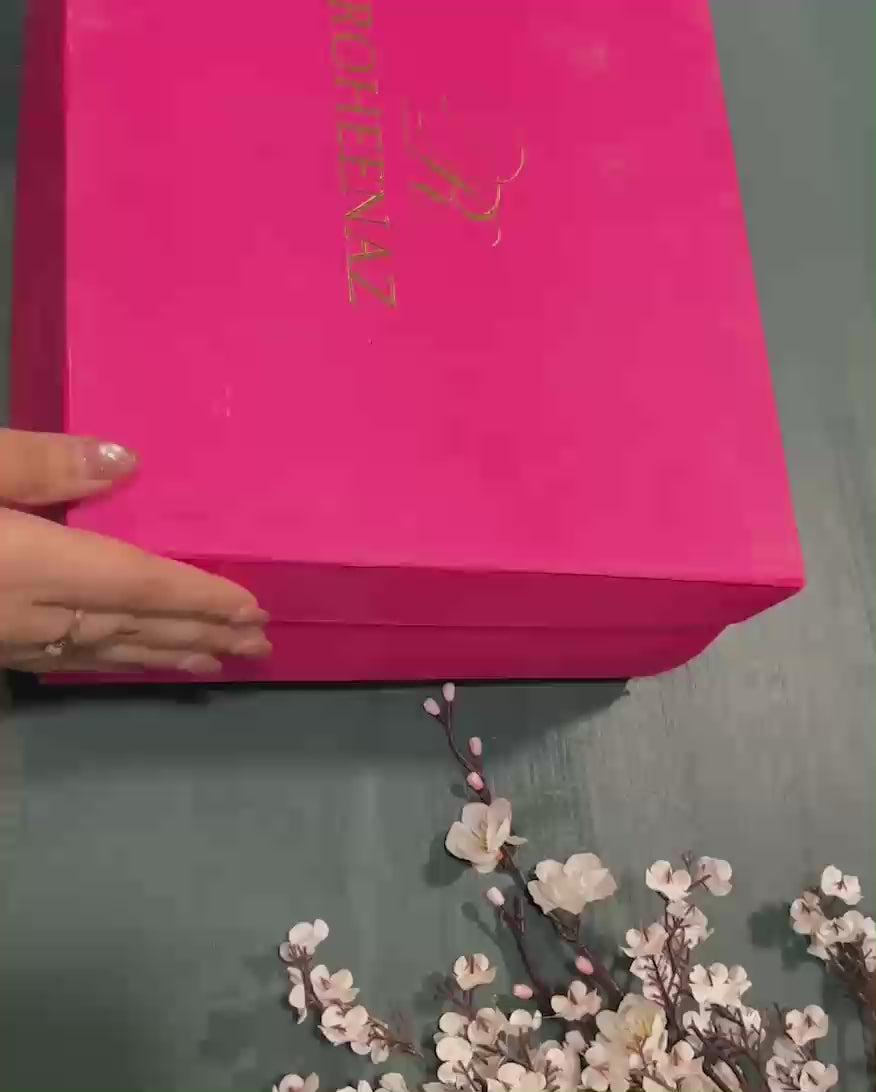 Unboxing the Empress Glow suit from Roheenaz's signature pink gift box packaging